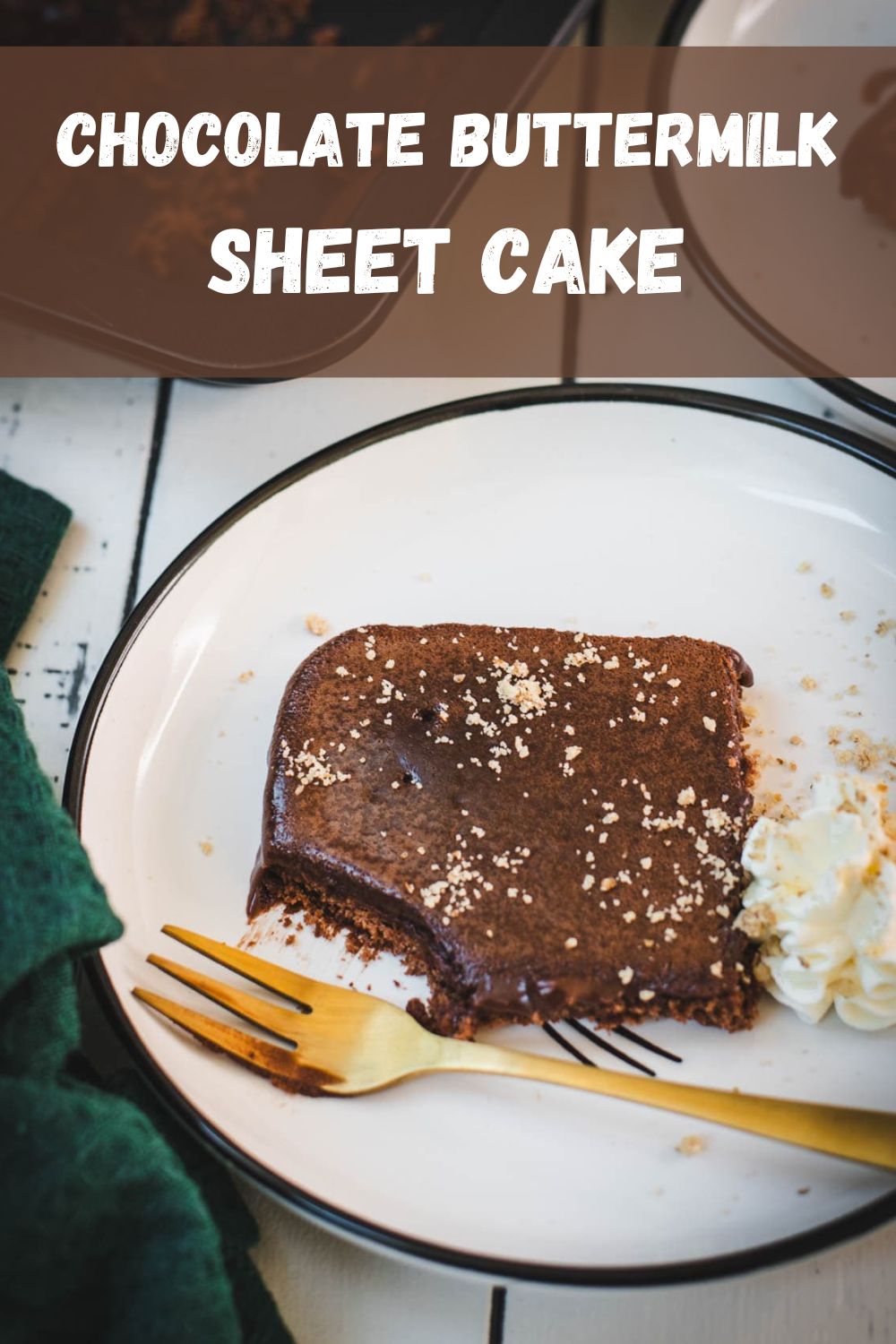 Chocolate buttermilk sheet cake on a table with fork